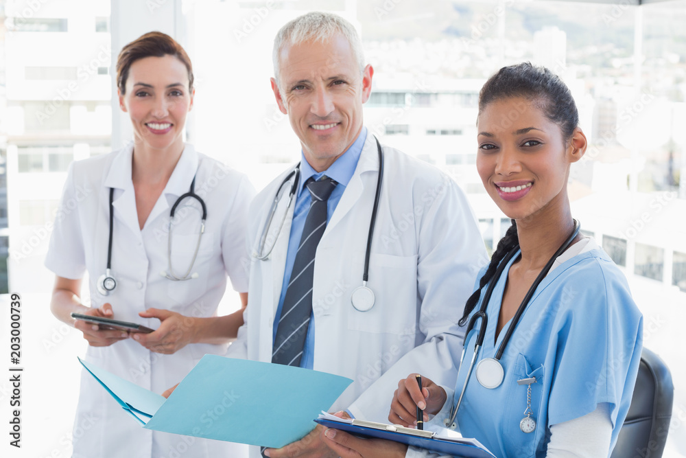 Doctors working together on patients file Doctors working together on patients file