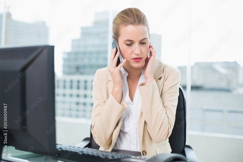 Worried attractive businesswoman on the phone Worried attractive businesswoman on the phone
