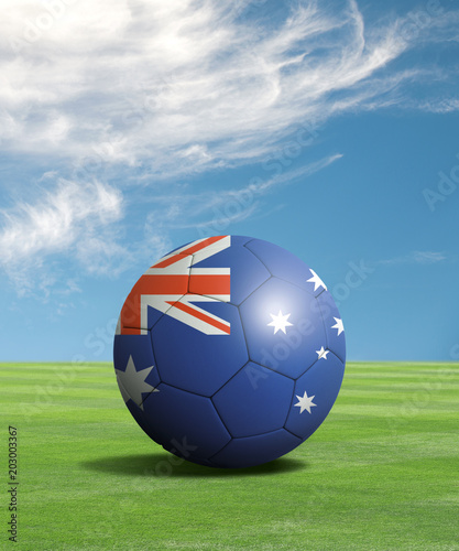 Soccer ball with Australia flags in a green field  