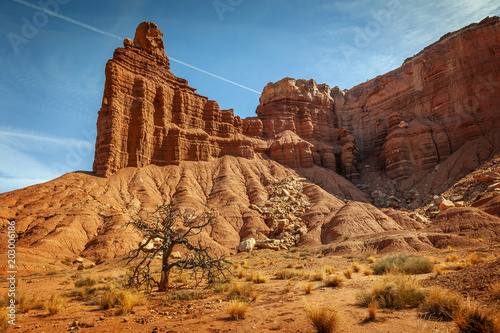 Chimney Rock, Capitol Reef National Park, Utah. This rock is a natural spire, eroded out of the side of the mesa, and stands 300 feet above the road.