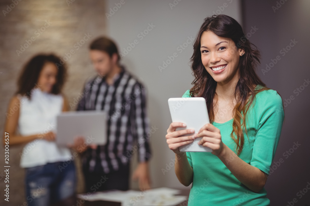 Female executive holding digital tablet Female executive holding digital tablet