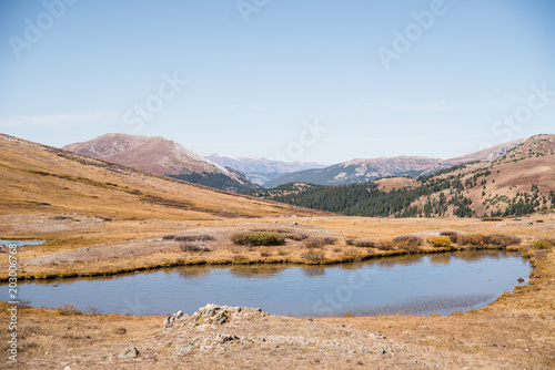 landscape view at Independence Pass near Aspen, Colorado of mountains and a pond. 