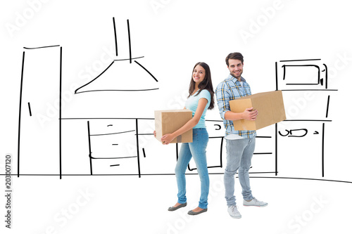 Happy young couple with moving boxes against kitchen sketch