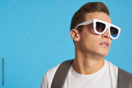 portrait of young man in sunglasses © SHOTPRIME STUDIO