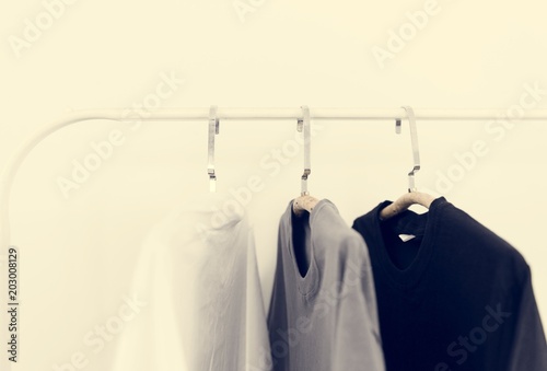 Basic Color Clothes Hanging on a Rack