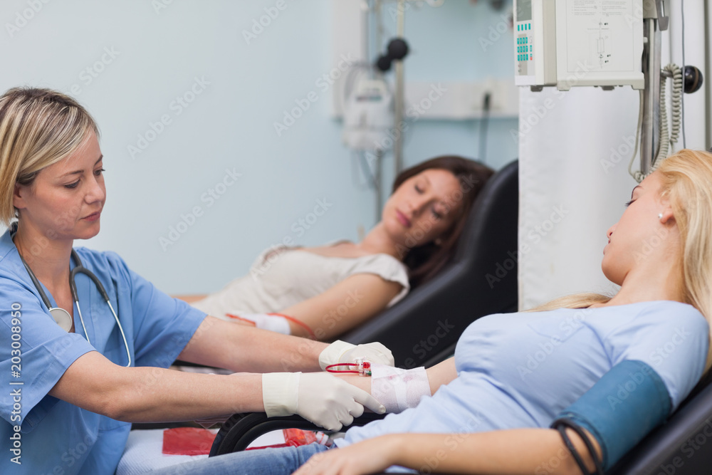 Fototapeta premium Nurse taking care of a patient