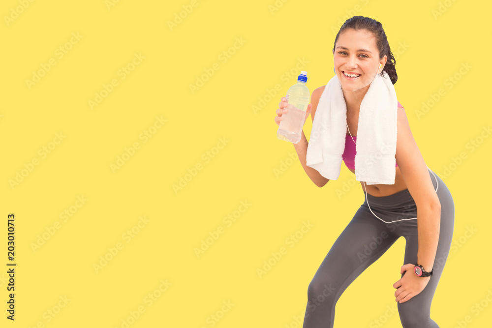 Fit woman with water against yellow vignette Fit woman with water against yellow vignette