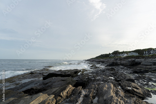 Early sunset at a rocky beach © Arunas