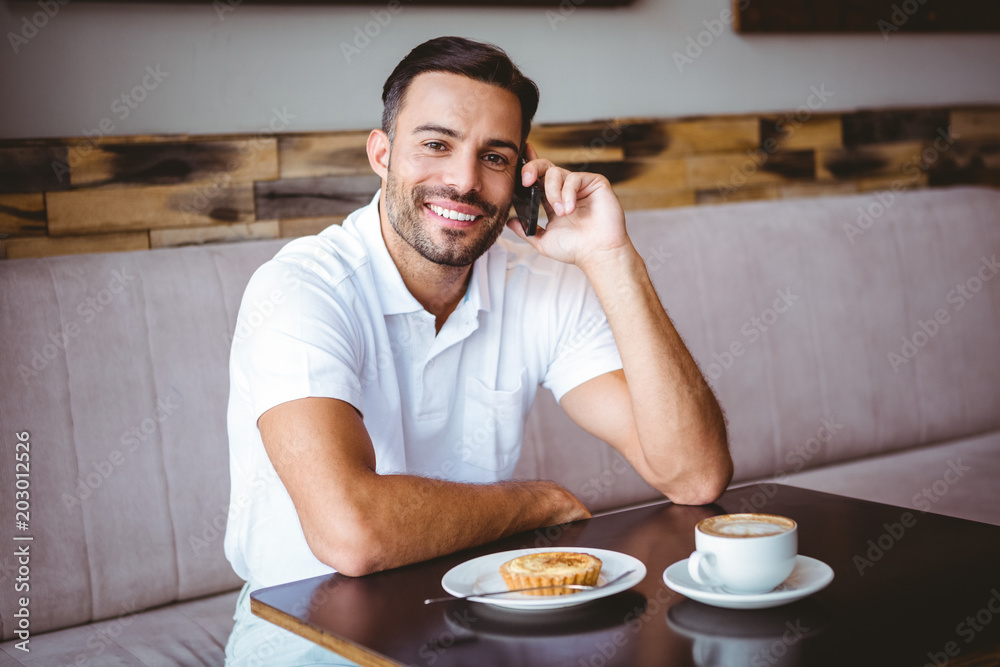 Young man smiling on the phone Young man smiling on the phone