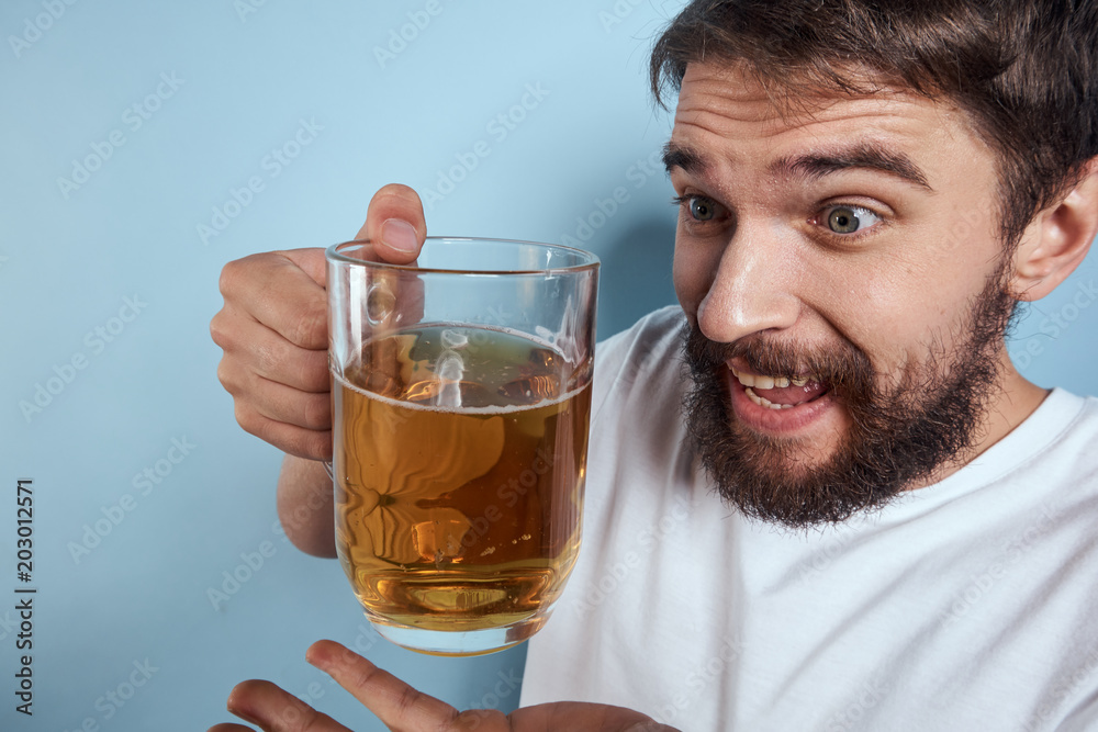 man with glass of beer