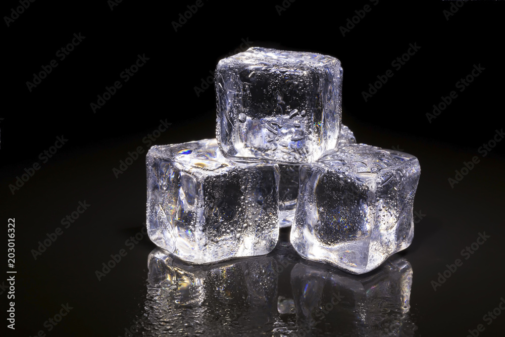 Ice cubes on black background.