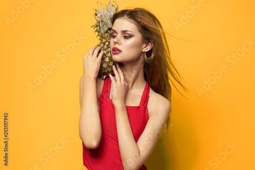 Beautiful woman with pineapple