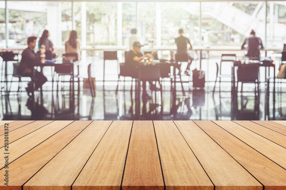 Wooden board or table and abstract blurred background. Free space can be used for photo montage or product display design and advertising Wooden board or table and abstract blurred background. Free space can be used for photo montage or product display design and advertising