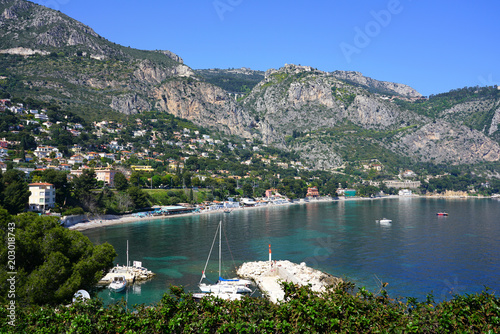 Fototapeta Naklejka Na Ścianę i Meble -  View of the town of Eze-sur-Mer on the Mediterranean below the ancient fortified medieval mountain village of Eze in Provence, French Riviera, France