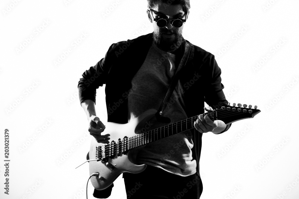 young man with a guitar young man with a guitar