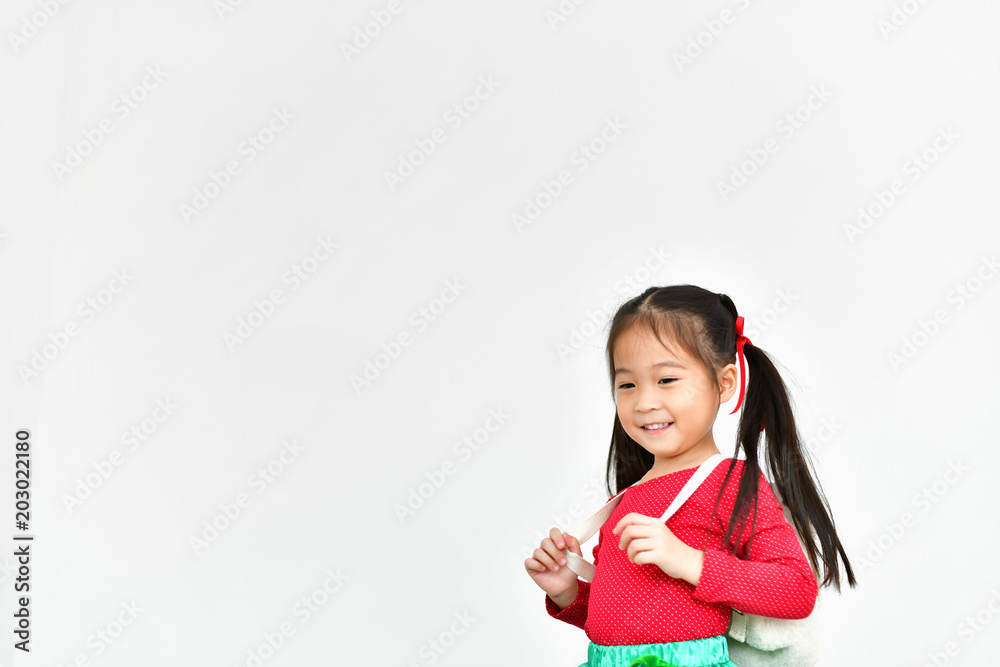 Little girl celebrates Christmas with red Santa dress. Little girl celebrates Christmas with red Santa dress.