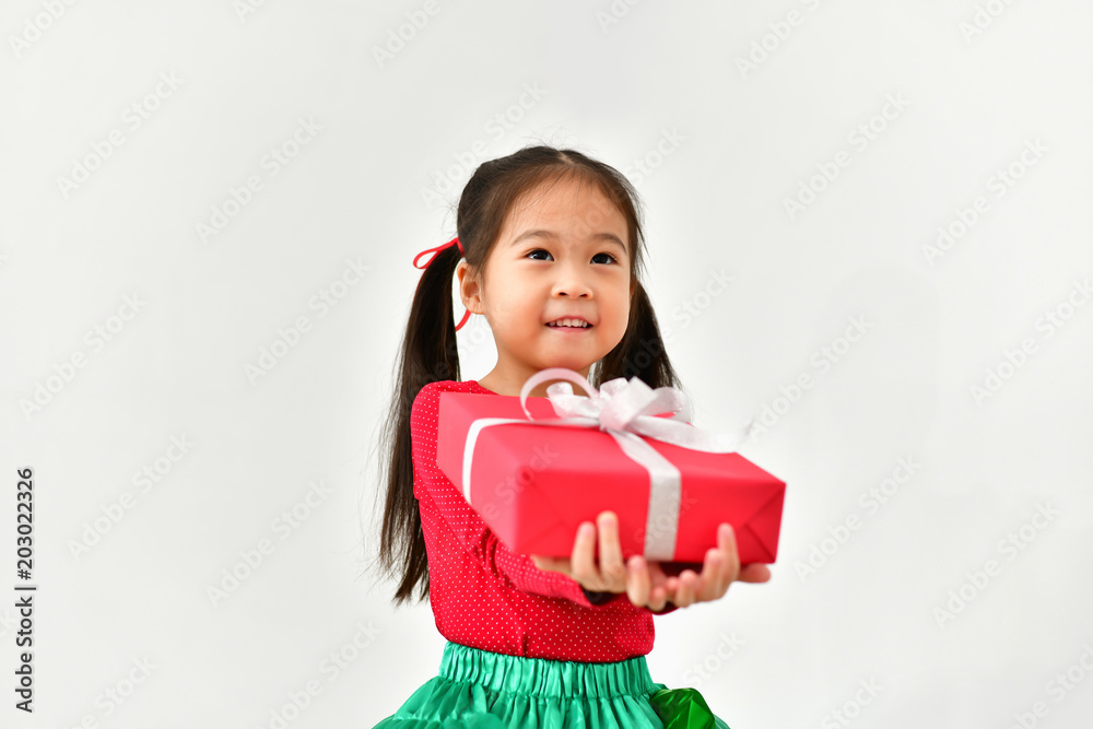 Little girl celebrates Christmas with red Santa dress. Little girl celebrates Christmas with red Santa dress.