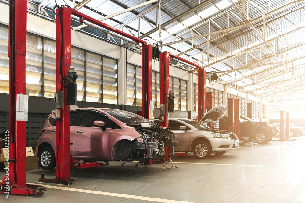 closeup car in automobile repair service center with soft-focus and over light in the background