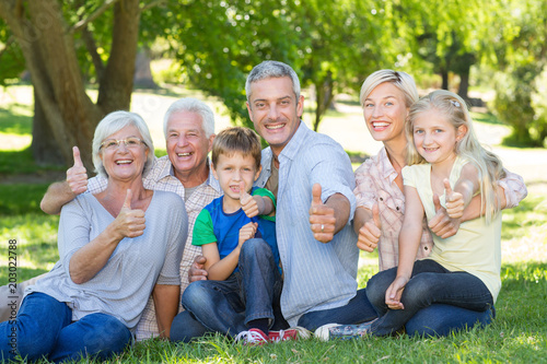 Happy family with thumbs up 