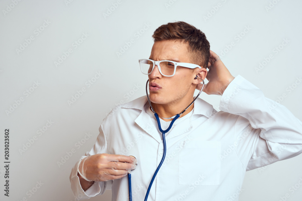 cardiologist with glasses and stethoscope cardiologist with glasses and stethoscope