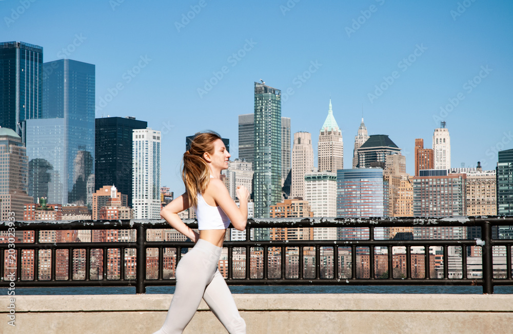 Run in the city. Woman is running in New York City