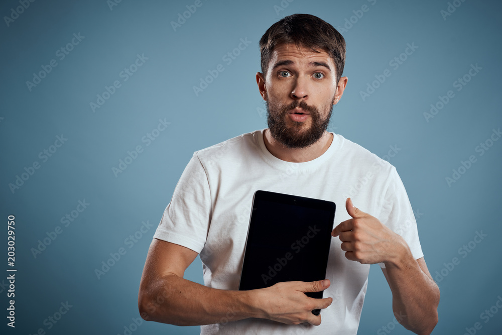 man is pointing at the tablet, bewildered man is pointing at the tablet, bewildered