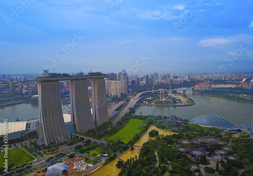 Aerial view panorama of Singapore skyscrapers with city skyline during cloudy summer day. © nelzajamal