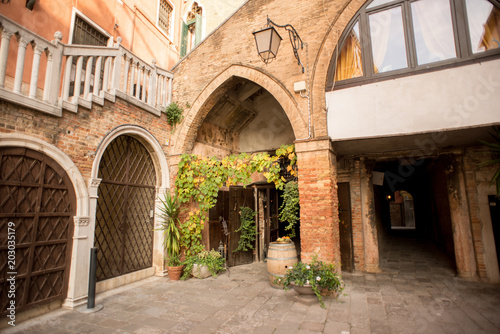 Fototapeta Naklejka Na Ścianę i Meble -  Venice Street with Ancient Buildings Made from Red Bricks.