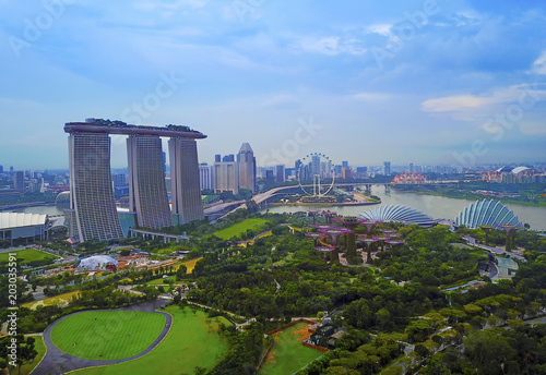 Aerial view panorama of Singapore skyscrapers with city skyline during cloudy summer day.