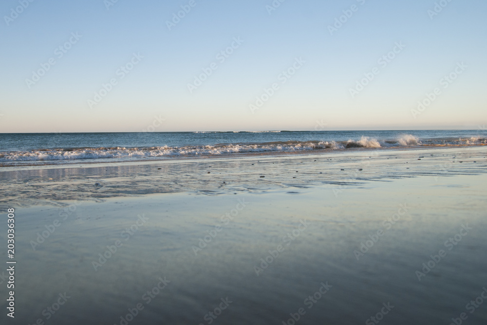 Sea waves on a beach ocean background in sunny day Sea waves on a beach ocean background in sunny day