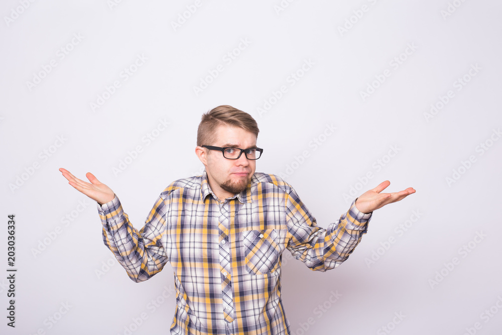 Young emotional surprised, frustrated and bewildered man. Human emotions, facial expression concept on white background. Young emotional surprised, frustrated and bewildered man. Human emotions, facial expression concept on white background.