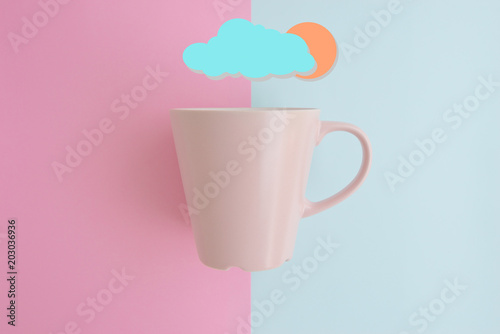 Minimal flat lay concept of pink coffee cup on the colorful background with copy space
