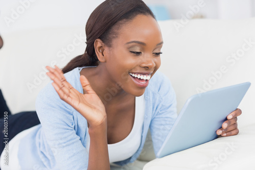 Black woman holding a tablet computer