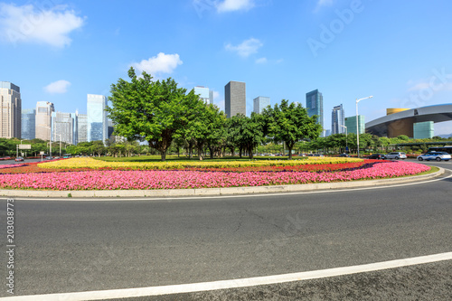 empty asphalt road and modern commercial office buildings in shenzhen