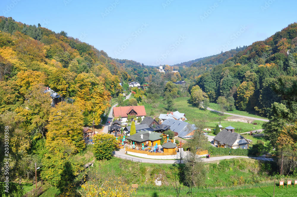 Mountain landscape with autumnal forest on a sunny day. Poland village, Ojcow park.