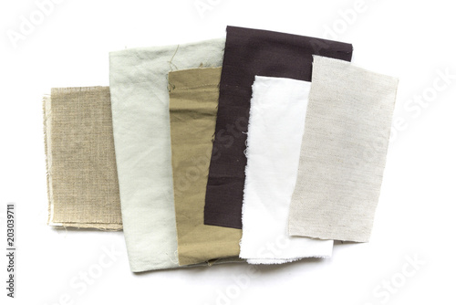 A lot of scraps of different fabrics on a white background.