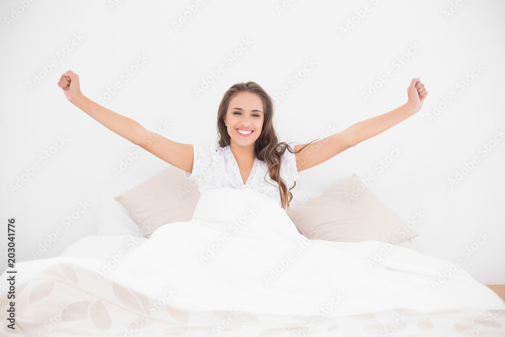 Cheerful pretty brunette lying in bed Cheerful pretty brunette lying in bed