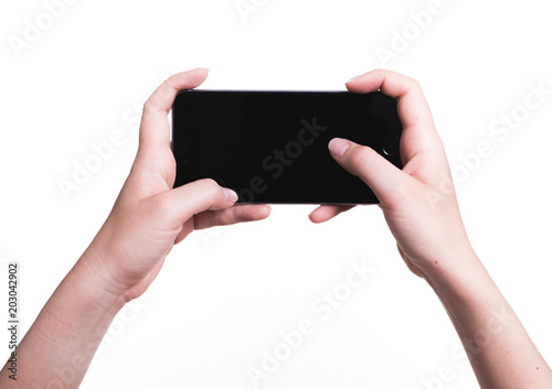 Female hand holding mobile smartphone play game gamer blank black screen