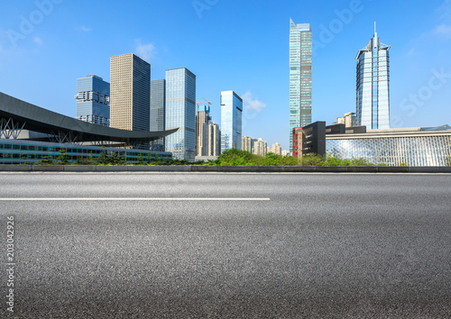 empty asphalt road and modern commercial office buildings in shenzhen