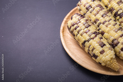 Fresh yellow sweet corn on the cob photo