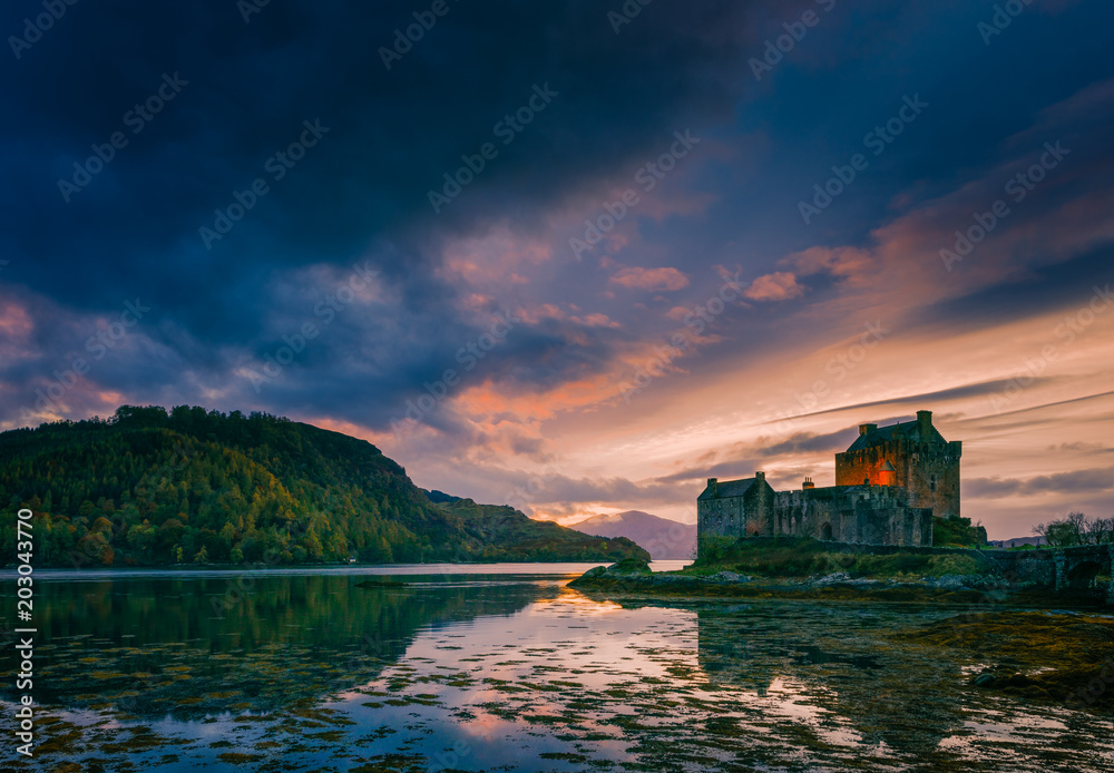 Eilean Donan Castle and a dramatic sunset sky on a Halloween evening