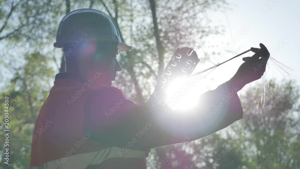 Telecommunications engineer working with optical coupling