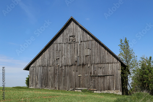 Old wooden shed in the middle of the field