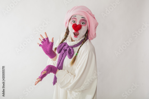 Fototapeta Naklejka Na Ścianę i Meble -  mime girl in a snowman costume. Man with emotions on a white background.