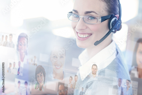 Business people against close up view of happy businesswoman with headset 