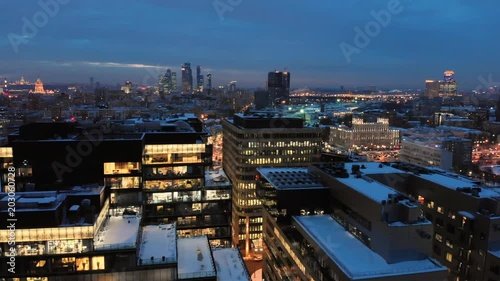 Wallpaper Mural Moscow White square modern business center. Winter evening smooth aerial shot.  Open-space offices through the illuminated windows. Torontodigital.ca