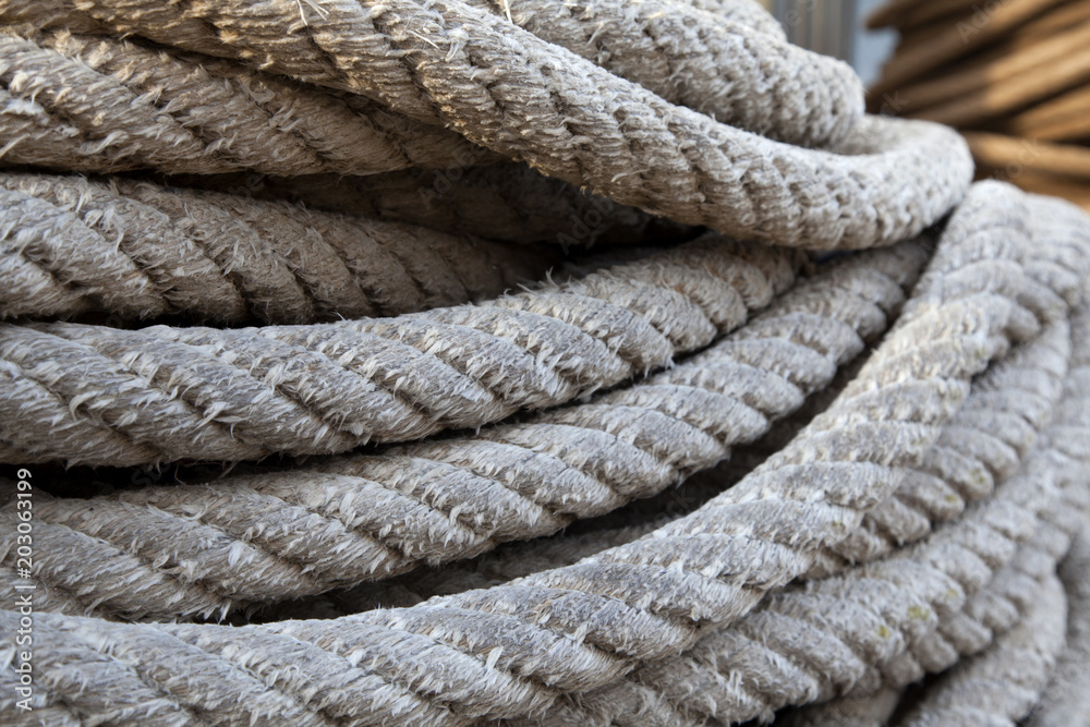 Thick braided rope. Texture of a braided rope. Fishing net. Stock Photo