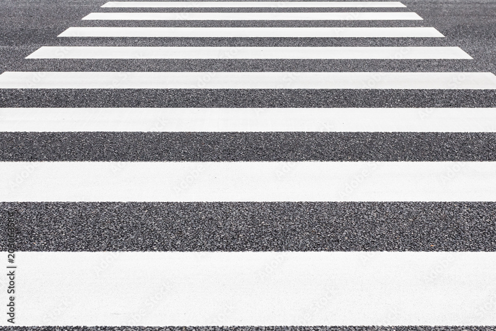 Fototapeta premium Close - up Zebra crossing pattern on city road