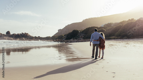 Loving mature couple on a beach walk