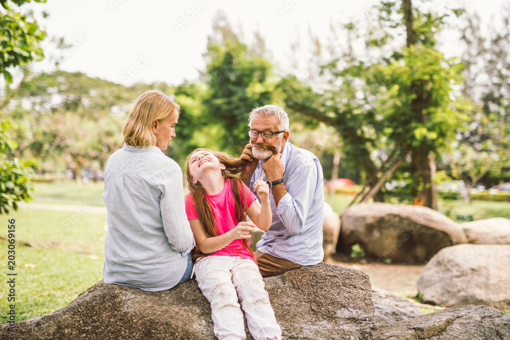 Fototapeta premium happy family playing in garden park